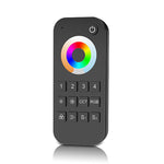 A black 4 Zone Universal Remote Control with a color wheel and numeric keypad.