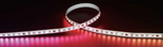 Roll of RGB LED strip light on a dark background