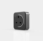 A black power track charging port with a white outline around the socket holes, set against a white background.