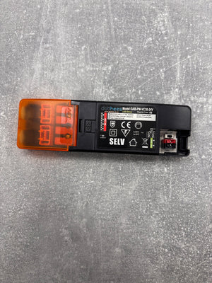 Electrical component with SELV marking on a gray surface
