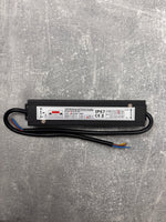 LED waterproof power supply driver on a gray textured surface