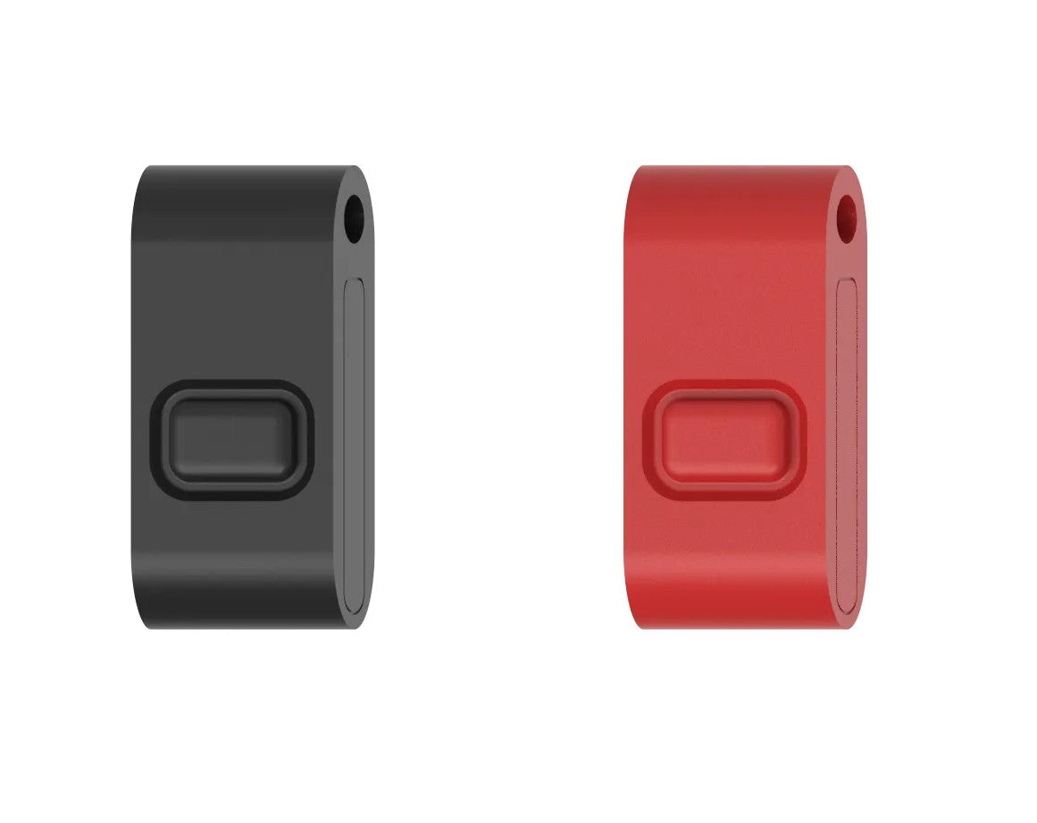 Two key FOBs, one black and one red, with a simple, solid colour design.