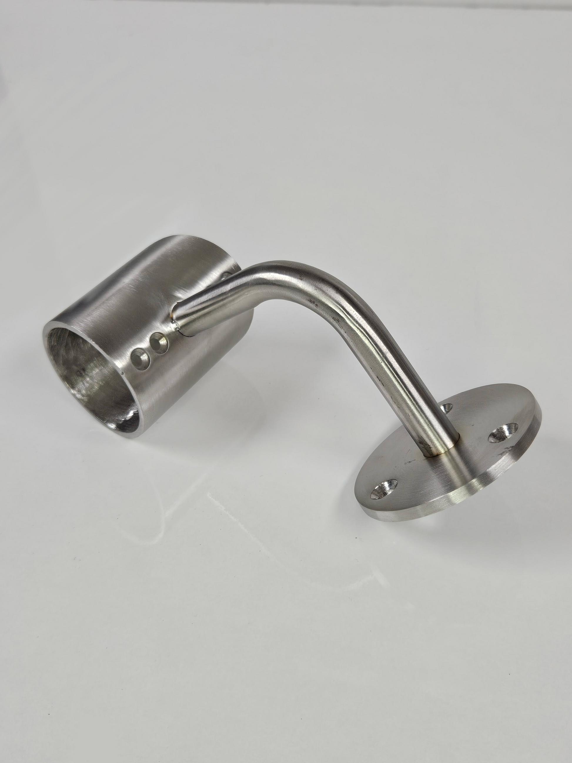 A brushed silver metal bracket with a cylindrical extension on one end, placed against a white background.