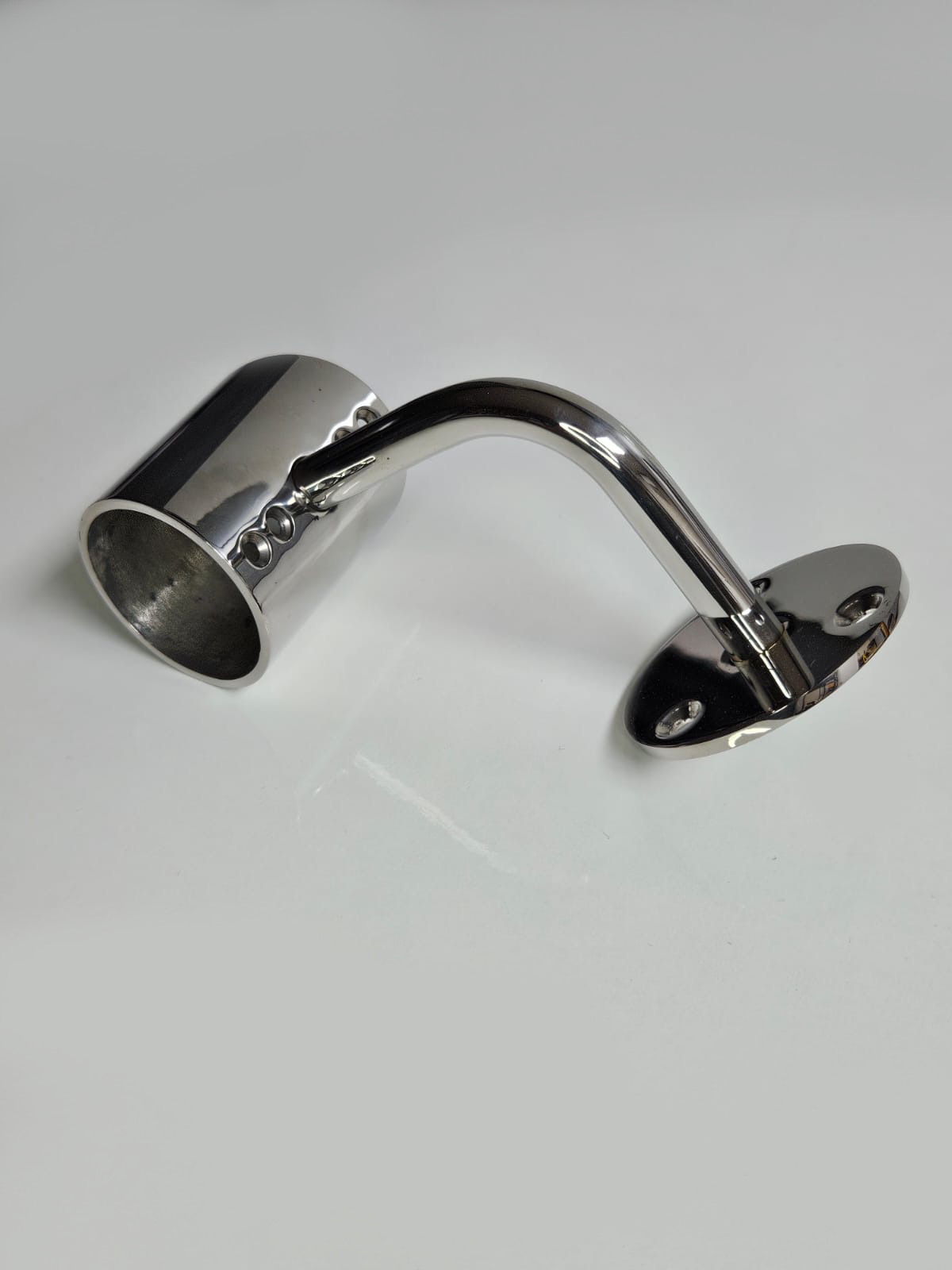 A silver metal bracket with a cylindrical extension on one end, placed against a white background.