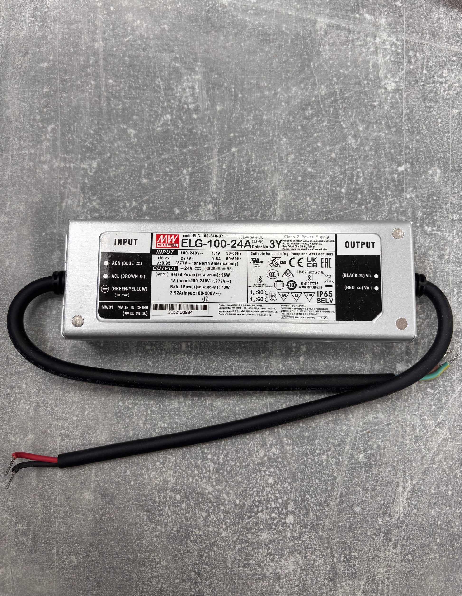 Power supply unit with label on a gray surface