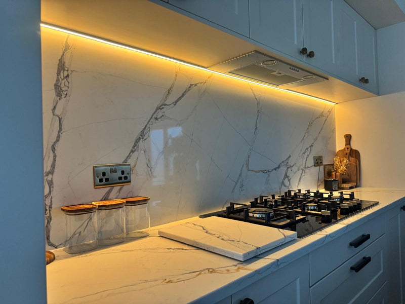 Modern kitchen with marble backsplash LED Lighting glow and gas stove