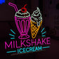 Neon sign featuring a milkshake and ice cream cone with colorful text on a dark background.