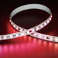 Roll of RGB LED strip light on a dark background