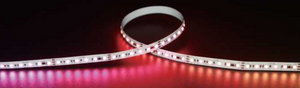 Roll of RGB LED strip light on a dark background