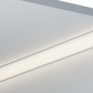 Corner LED profile installed at wall junction with warm white light