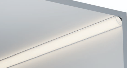 Corner LED profile installed at wall junction with warm white light