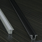 Metallic U-shaped profile on a dark wooden surface