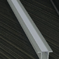Close-up of a metallic strip on a dark surface