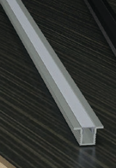 Close-up of a metallic strip on a dark surface
