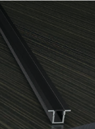 Metal profile on a dark wooden surface