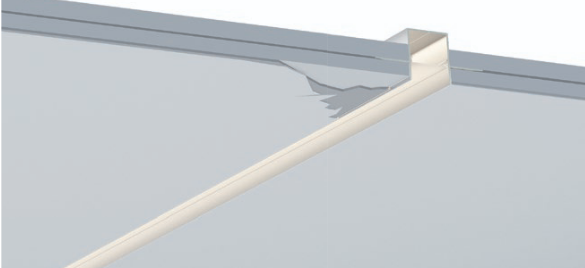 Close-up of a metal profile with a reflective surface on a light gray background