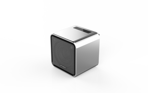 A silver cube-shaped sound speaker with a speaker grill on the front.