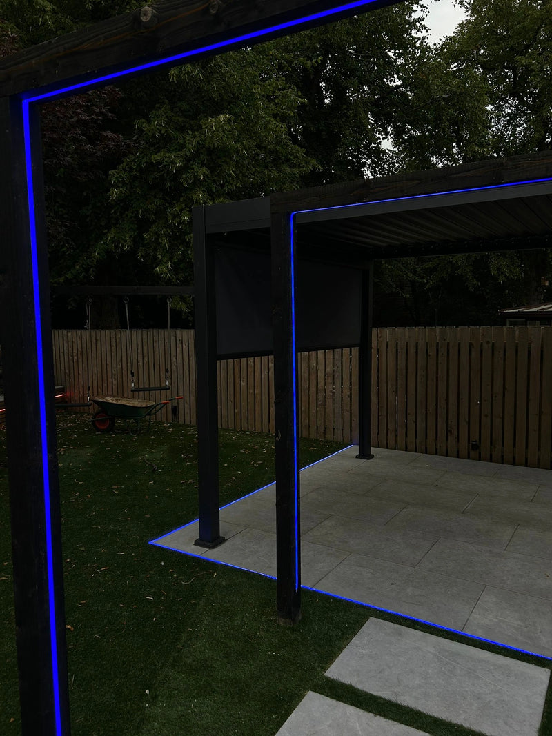 Outdoor patio area with a gazebo and blue lighting