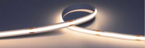 Close-up of a  LED strip light in warm  white on a dark background