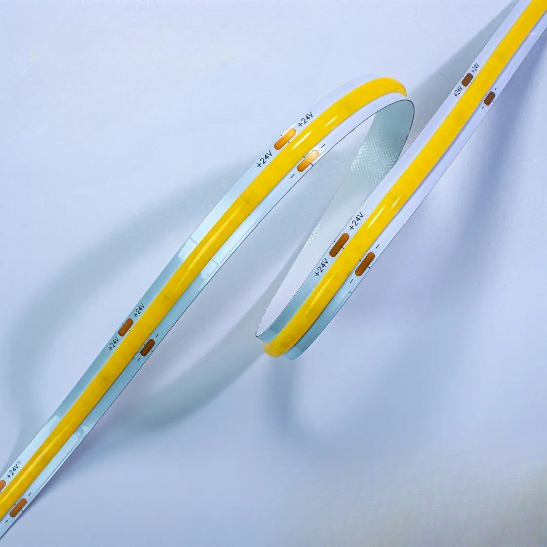 Two yellow LED strips on a light gray background
