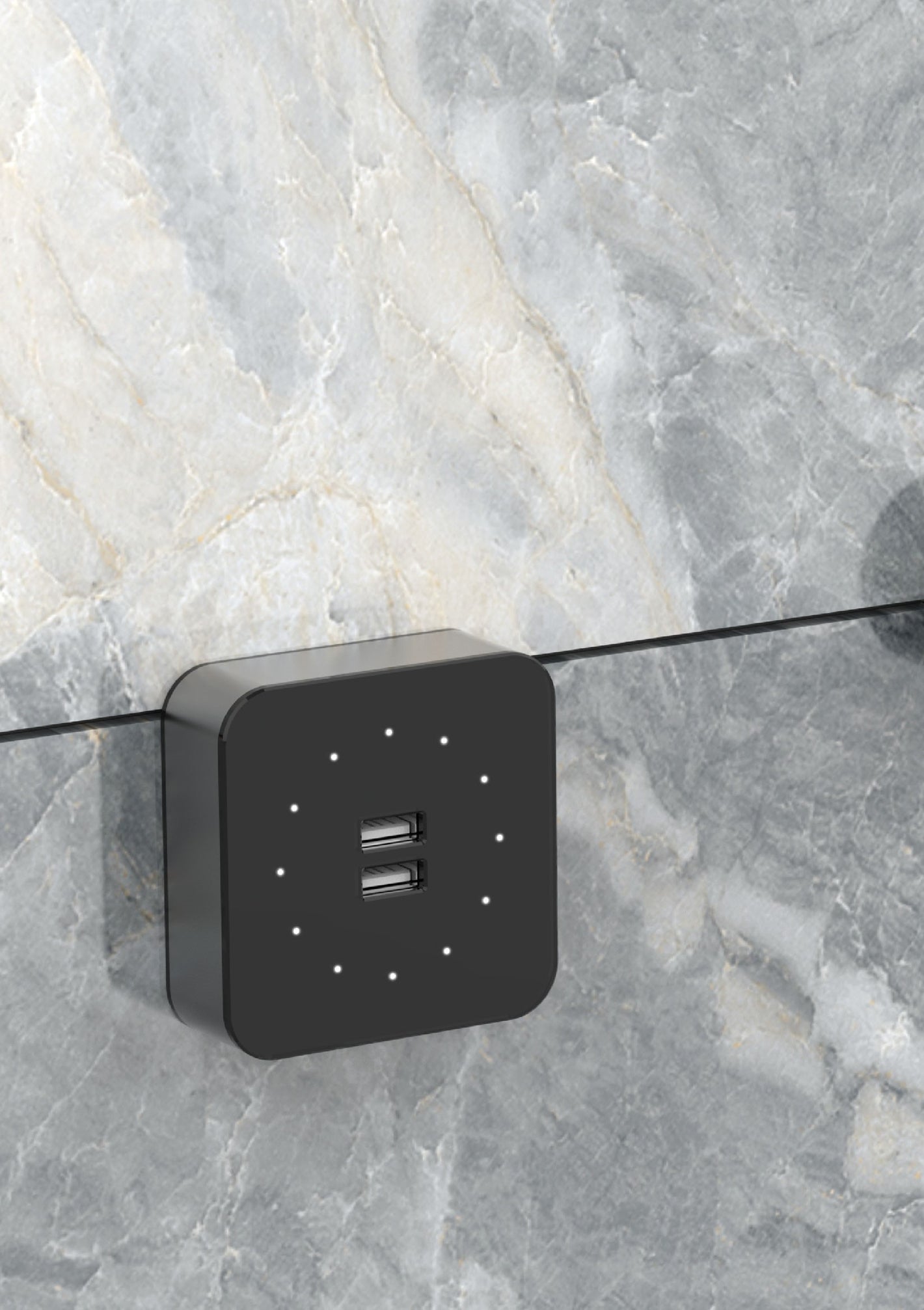A black power track lighting fixture mounted on a marble surface.