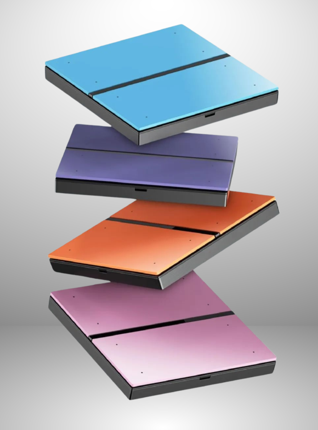 Colourful LED light switches/remotes stacked on a grey background