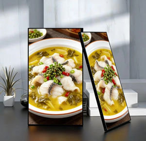 Two rectangular mirrors showing a dish of fish in a yellow sauce with green vegetables on a wooden surface.