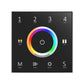 A black remote control panel with a colour wheel in the centre and touch keys labeled 1 to 4, ZONE, ROUND, with LED indicators around the edge.