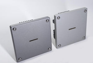 Two wall mount charging base station with a magnetic wireless charging pad